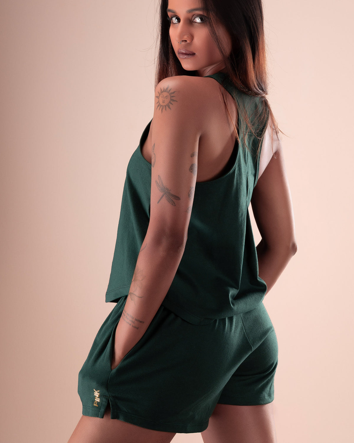 Women's forest green lounge set with a relaxed tank top and matching shorts.