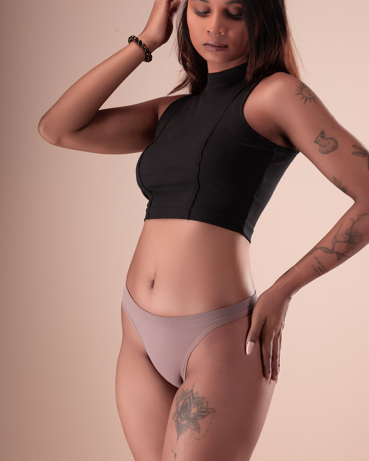Women's ribbed tanga underwear with a textured finish.