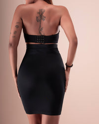 Black high-waisted shapewear skirt shown from the back.